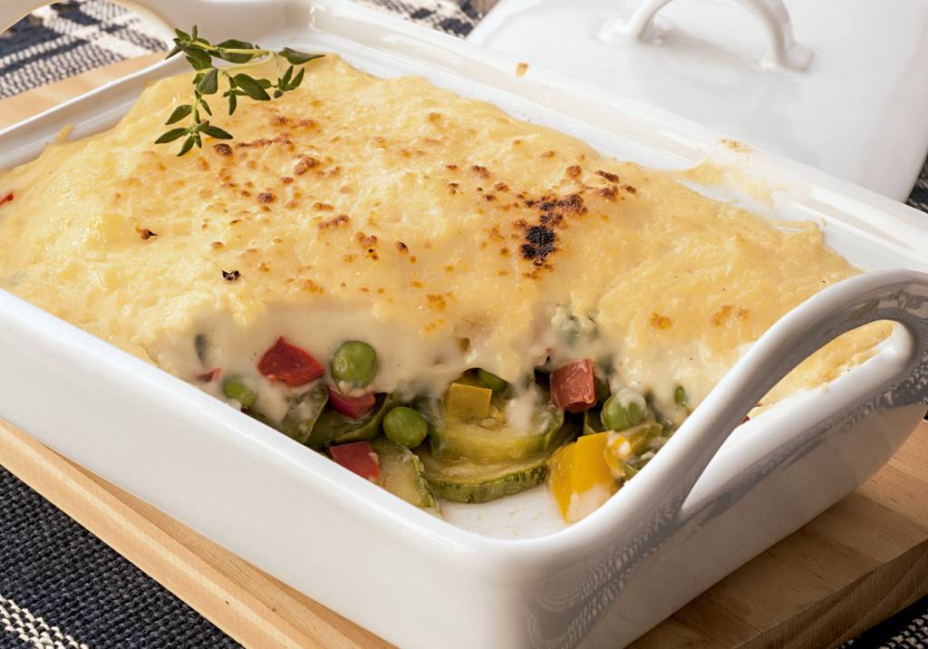 Legumes gratinados com creme de queijo