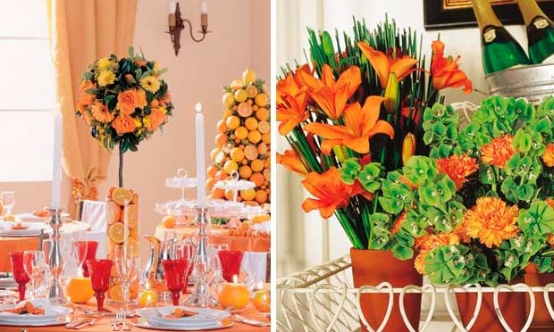 Mesa decorada em laranja com arranjo de limões e laranjas e narcisos