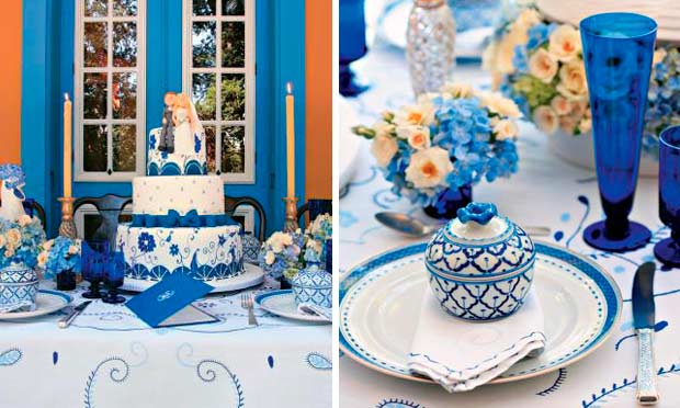 Mesa decorada em azul com detalhes de louças portuguesas
