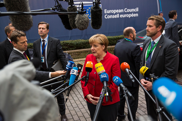 BRUSSELS, BELGIUM - OCTOBER 20: German Chancellor Angela Merkel addresses assembled media as she arrives at the Council of the European Union on the first day of a two day summit on October 20, 2016 in Brussels, Belgium. Theresa May is attending her first EU Council meeting as the British Prime Minister. The government's Brexit strategy continues to be debated in the UK with Article 50 of the Lisbon treaty to be triggered by the end of March 2017. Article 50 notifies the EU of a member state's withdrawal and the EU is then obliged to negotiate a withdrawal agreement. The process will take two years seeing the UK finally withdraw from the Union in March 2019. (Photo by Jack Taylor/Getty Images)