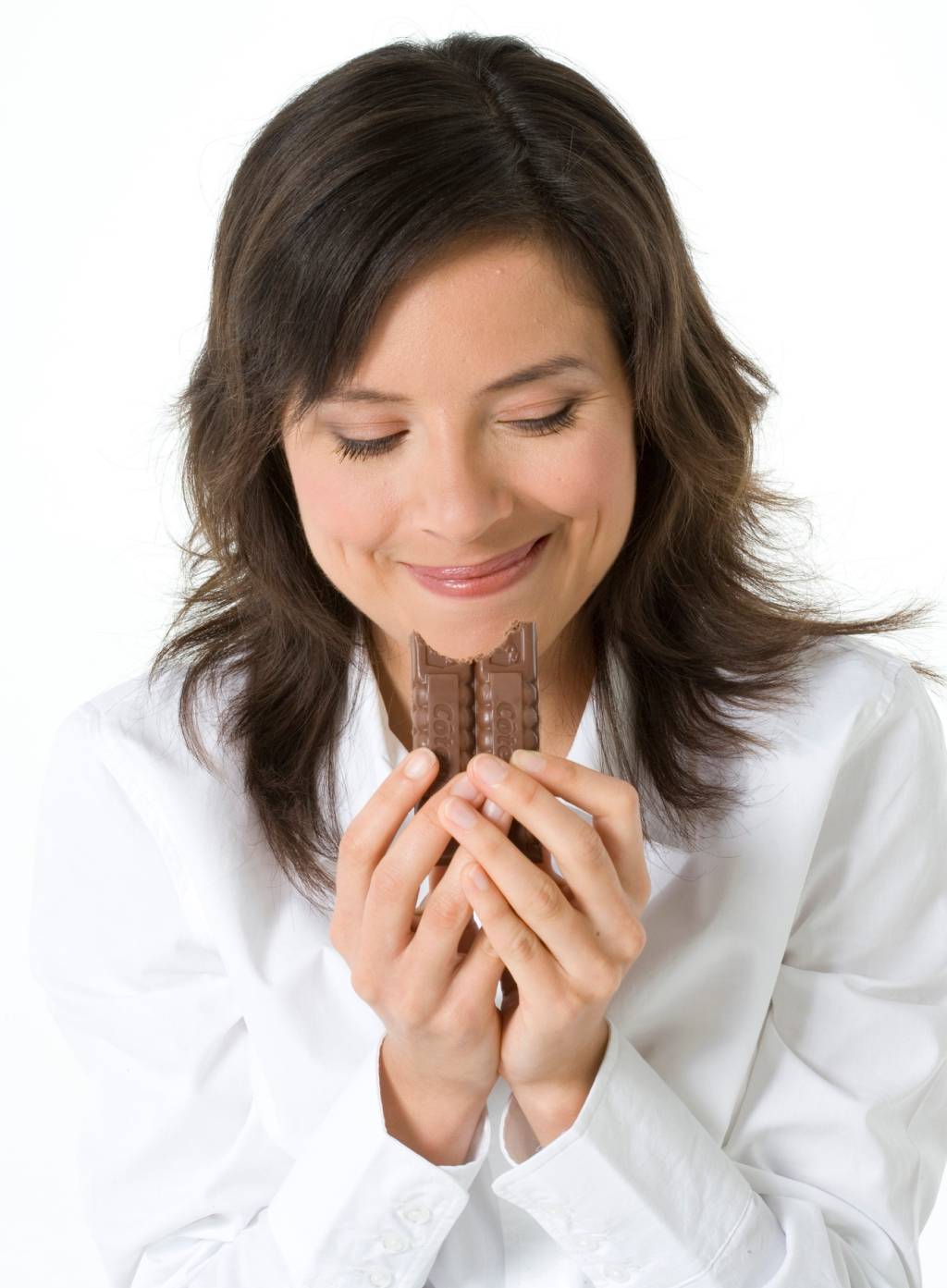 Young woman eating chocolate