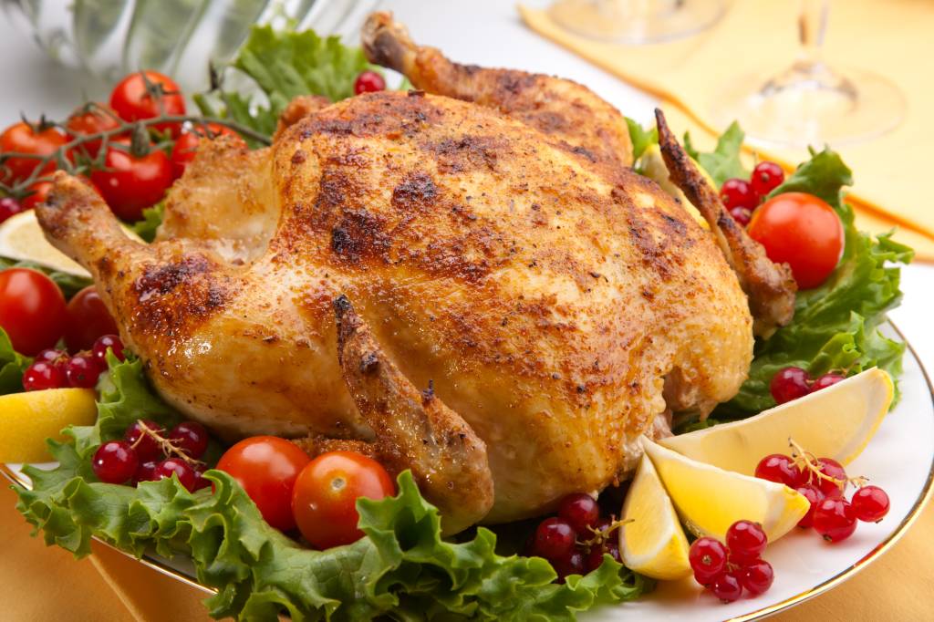 Whole roasted chicken on table