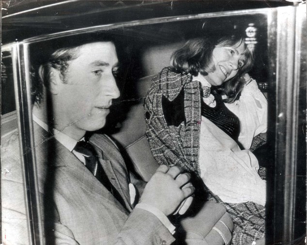 PKT 458 - 91051 LP3D PRINCE OF WALES - GIRLFRIENDS (CAMILLA PARKER-BOWLES) 13th FEBRUARY 1975 CHARLES AND CAMILLA (LEFT) LEAVE THEATRE NOTE: ANDREW PARKER BOWLES BEHIND CHARLES. A night out in the West End for Prince Charles and a laughing friend. The girl sharing the back seat of Prince Charles car last night is Lord Ashcombe's niece, Mrs Camilla Parker-Bowles, wife of Charles polo-playing friend, Major Andrew Parker-Bowles. Last week the Prince was godfather to their first child. They went to see 'Deja Revue', starring Sheila Hancock, and George Cole. The Prince, taking a night off from the Navy, laughed a lot - especially during a saucy scene in which actress Anna Dawson strips down to stockings suspenders.
