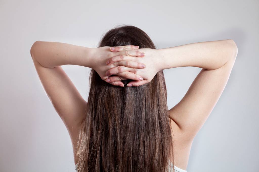 Young woman with crossed hands