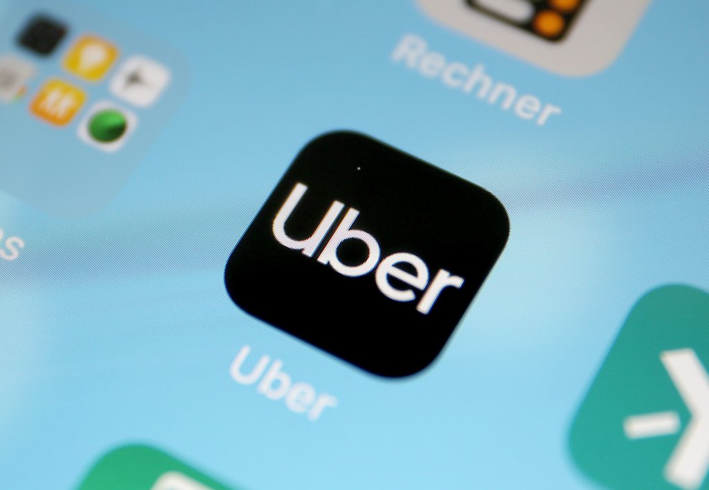 11 April 2019, North Rhine-Westphalia, Köln: The About app on a smartphone. Uber arranges trips in Cologne with immediate effect. Photo: Oliver Berg/dpa (Photo by Oliver Berg/picture alliance via Getty Images)