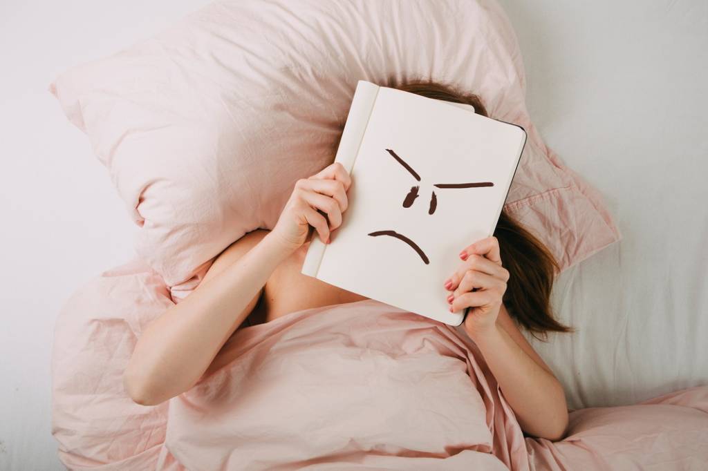 Young woman in bed