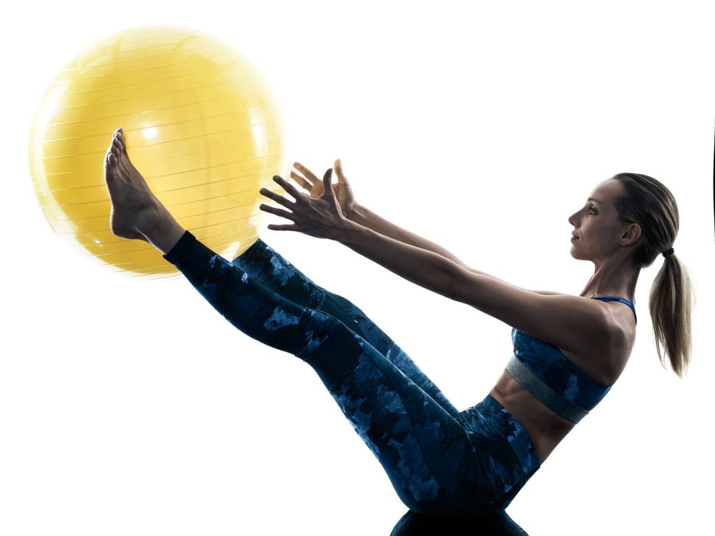 woman fitness swiss ball excercises silhouette
