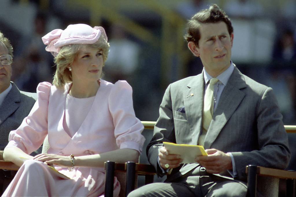 NEWCASTLE, AUSTRALIA - 1983: Princess Diana And Prince Charles watch an official event during their first royal Australian tour 1983 IN Newcastle, Austrlia. (Photo by Patrick Riviere/Getty Images)