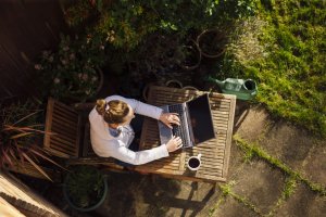 Woman working from home in her garden