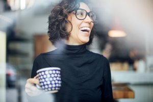 Cheerful businesswoman at coffee shop