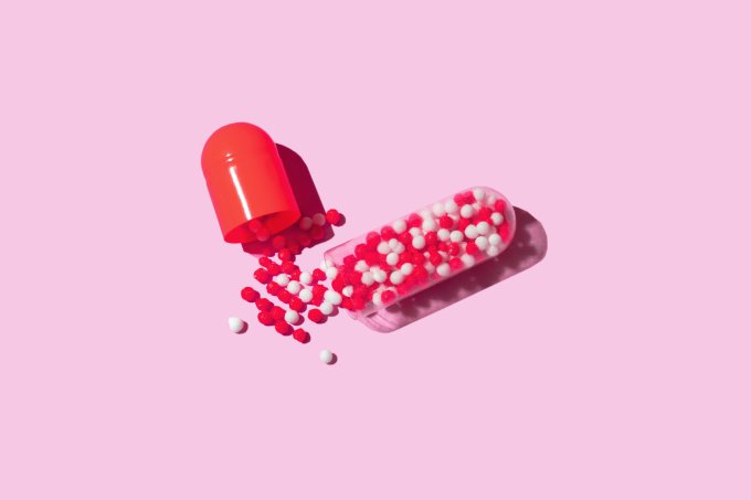 Red Pill on pink background