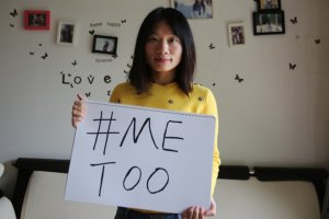 Sophia Huang Xueqin, a freelance journalist who wants to raise peopleé??s awareness on sexual harassment in China, poses with a #MeToo sign at her home. 08DEC17 SCMP/Thomas Yau