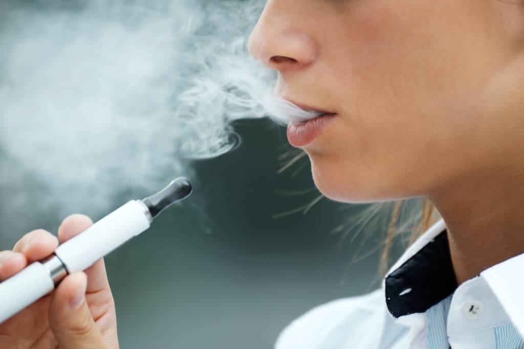 Close-Up Of Woman Smoking Electronic Cigarette vaping