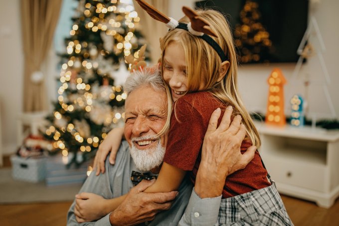 Grandfather and granddaughter preparing for New year