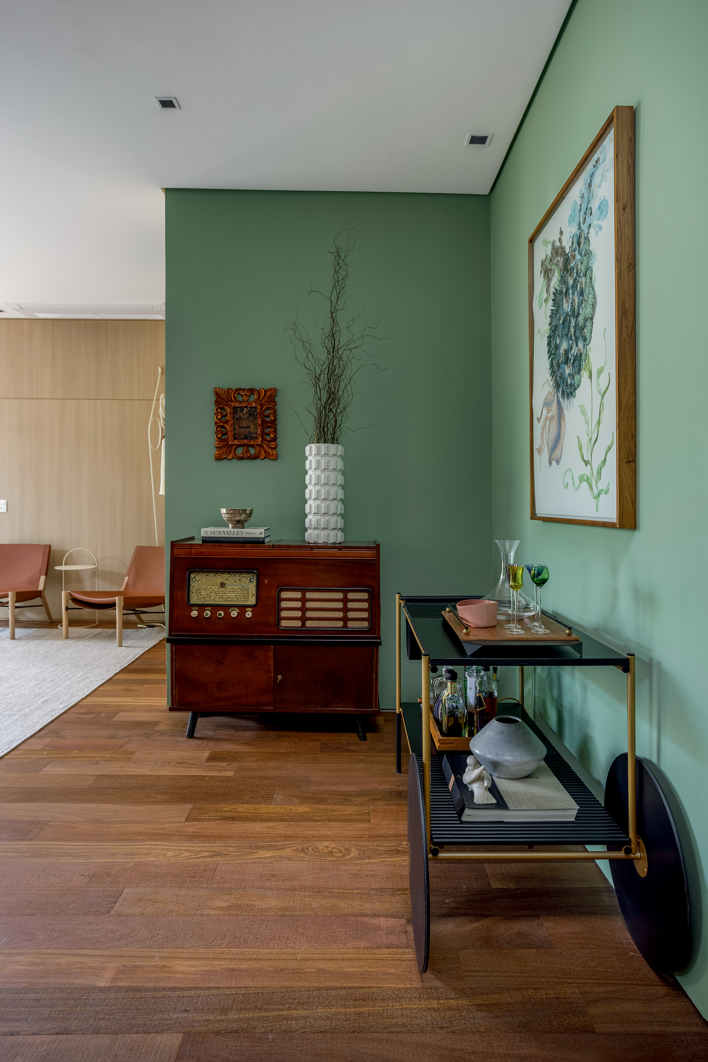 In this project by architect Duda Senna, the family-inherited record player has become a charming sideboard