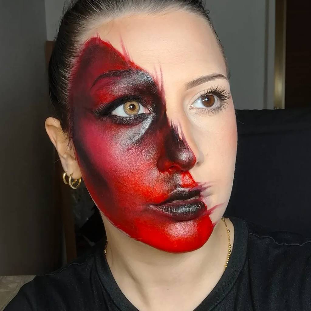 Maquiagem de Halloween com efeito de queimadura artística e tons vermelhos e pretos