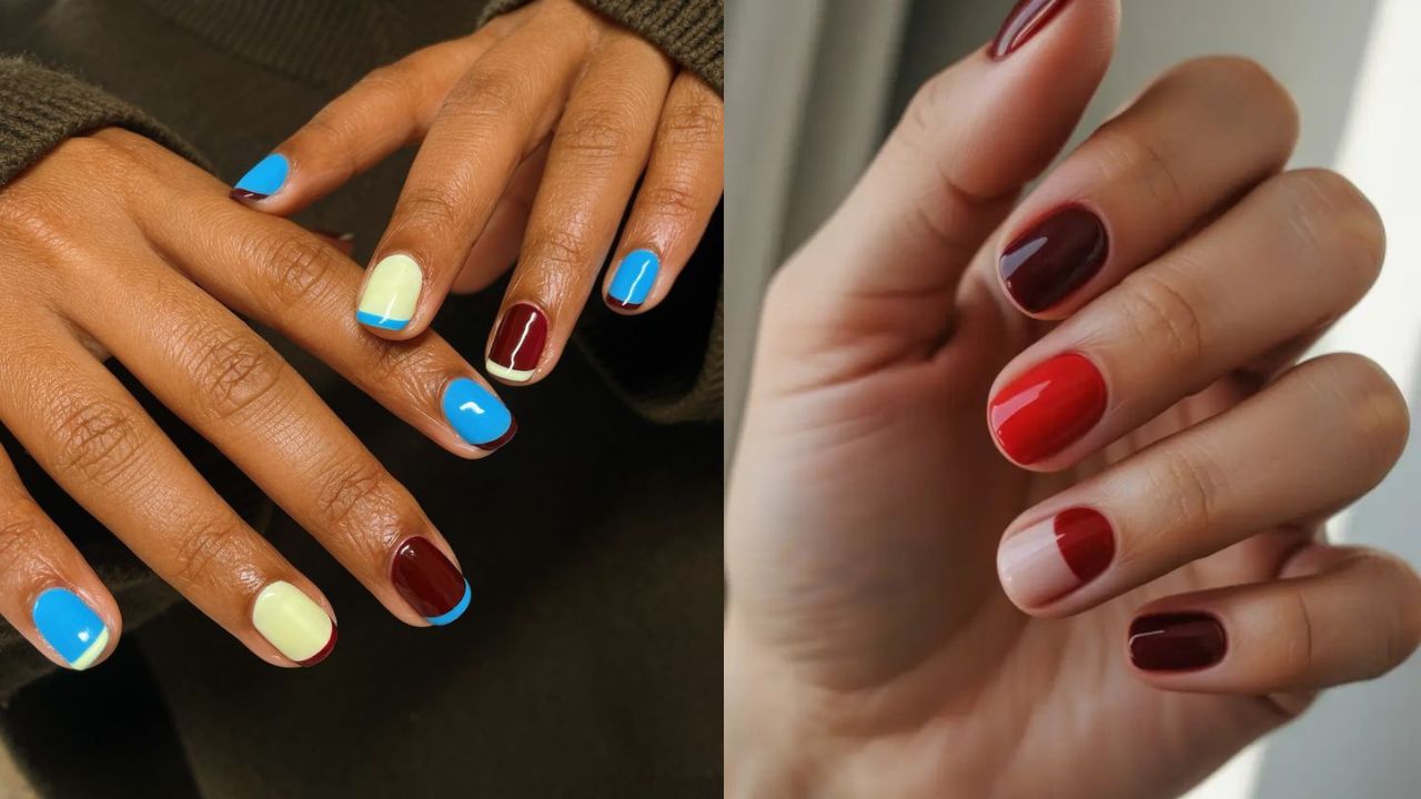 M&atilde;os com unhas em tons vibrantes e contrastantes, misturando azul, amarelo e vinho em um estilo divertido e ousado. Na imagem ao lado, unhas aparecem com esmalta&ccedil;&atilde;o em vermelho e vinho, incluindo detalhes &ldquo;meio a meio&rdquo; em alguns dedos.