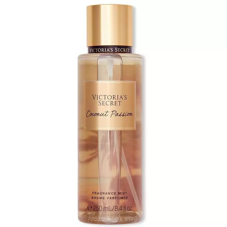 Frasco transparente de perfume Victorias Secret Coconut Passion, com l&iacute;quido &acirc;mbar e tampa dourada. O r&oacute;tulo dourado exibe o nome do produto e a marca em letras pretas. Na base, Fragrance Mist e 250 mL / 8.4 fl.oz
